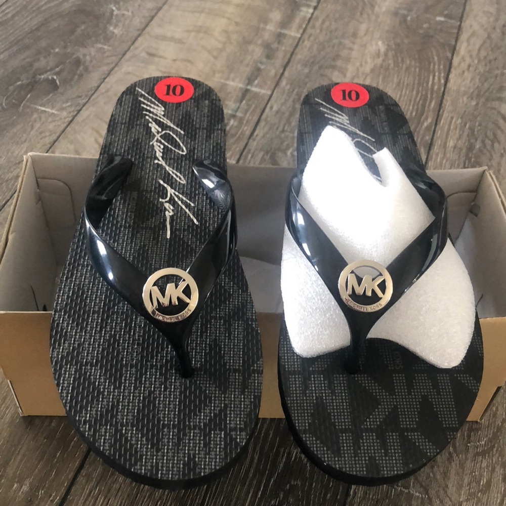 New Michael Kors flip flops. Size 10. Never worn